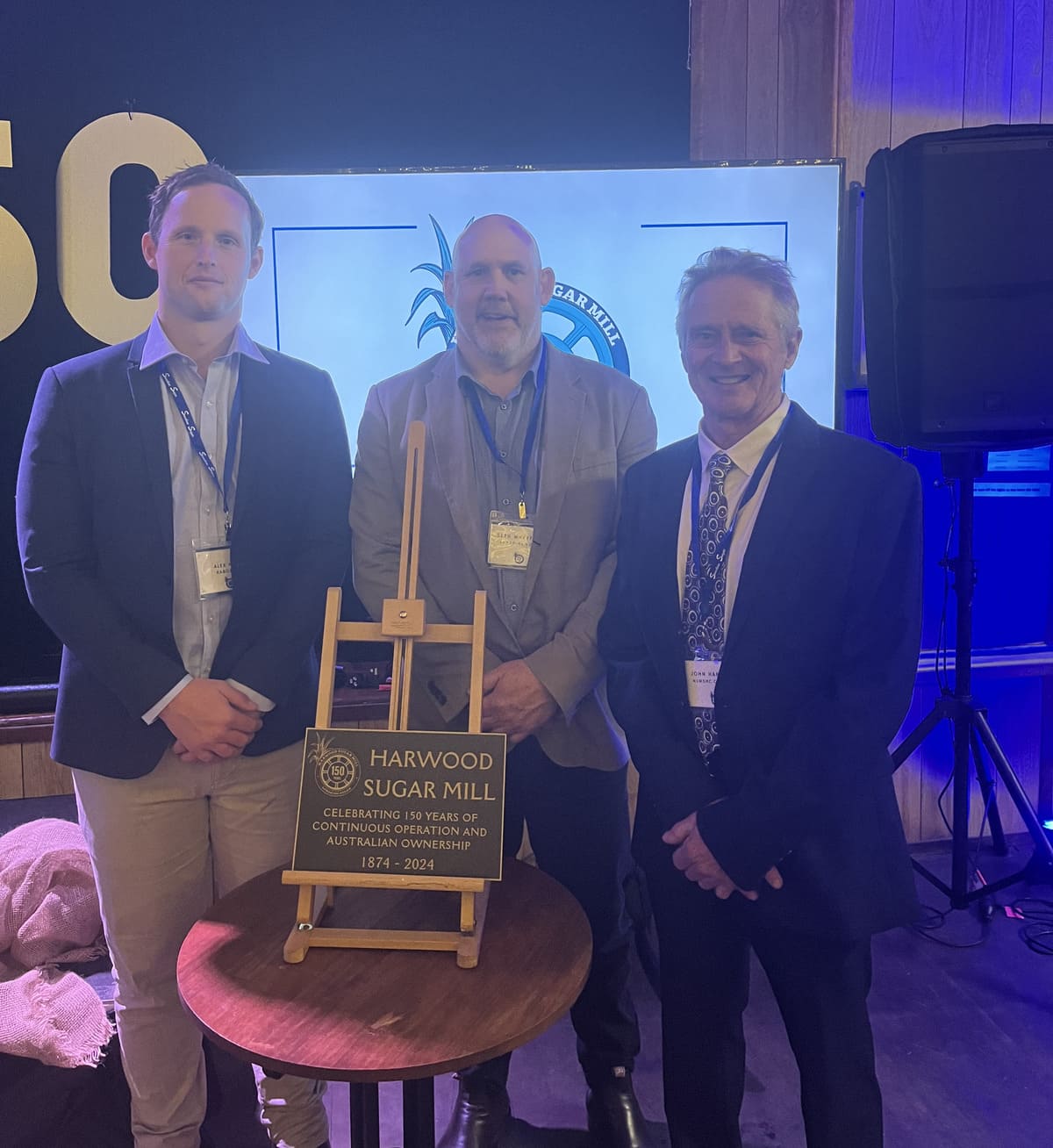 Rabobank’s Alex Kelly with Sunshine Sugar’s Seth Wreyford and NSW Sugar Milling Co-operative’s John Harbison celebrate the Harwood sugar mill.